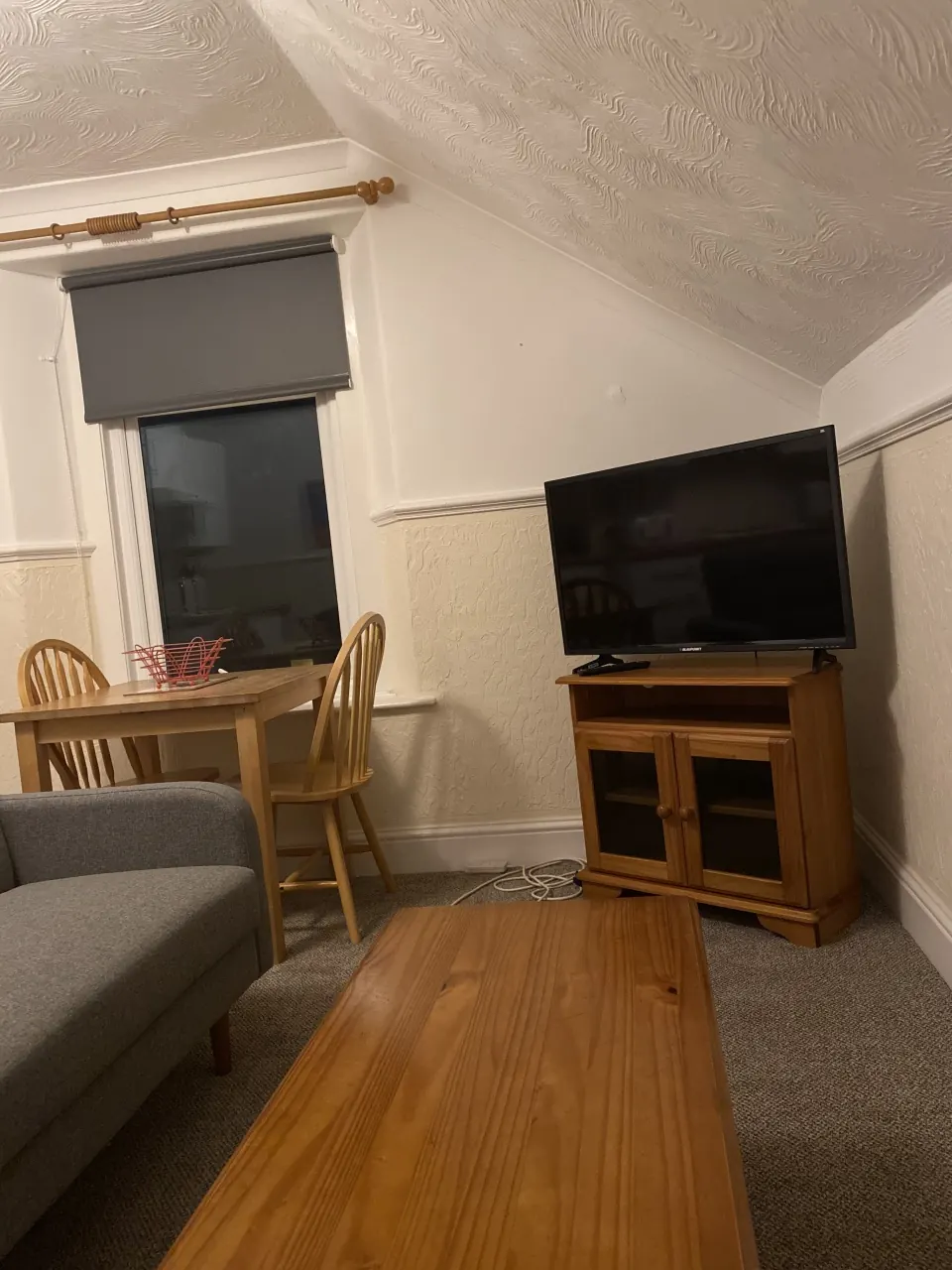 Dining area and television in the Large Apartment