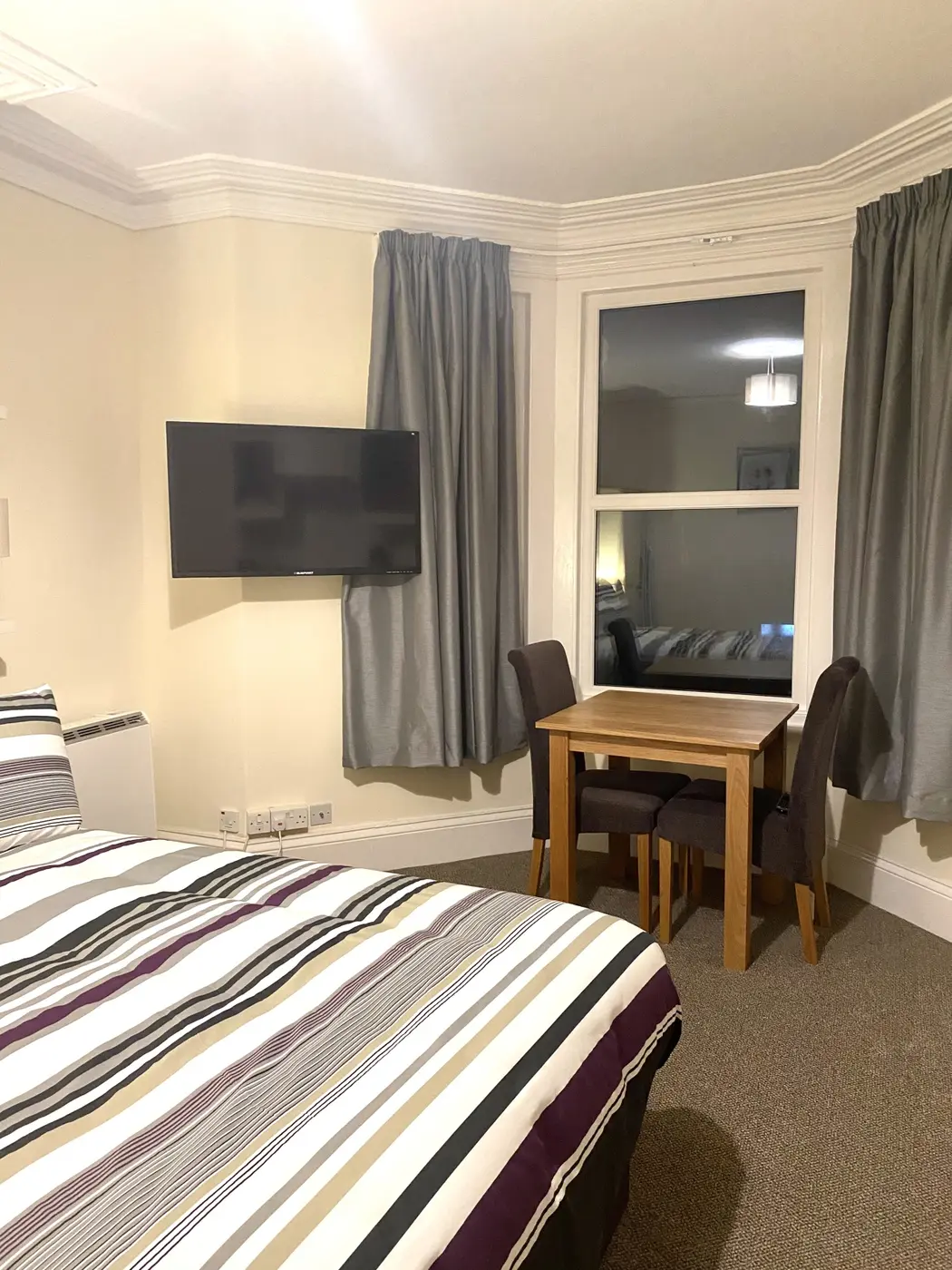 Dining area and television in the Studio Apartment