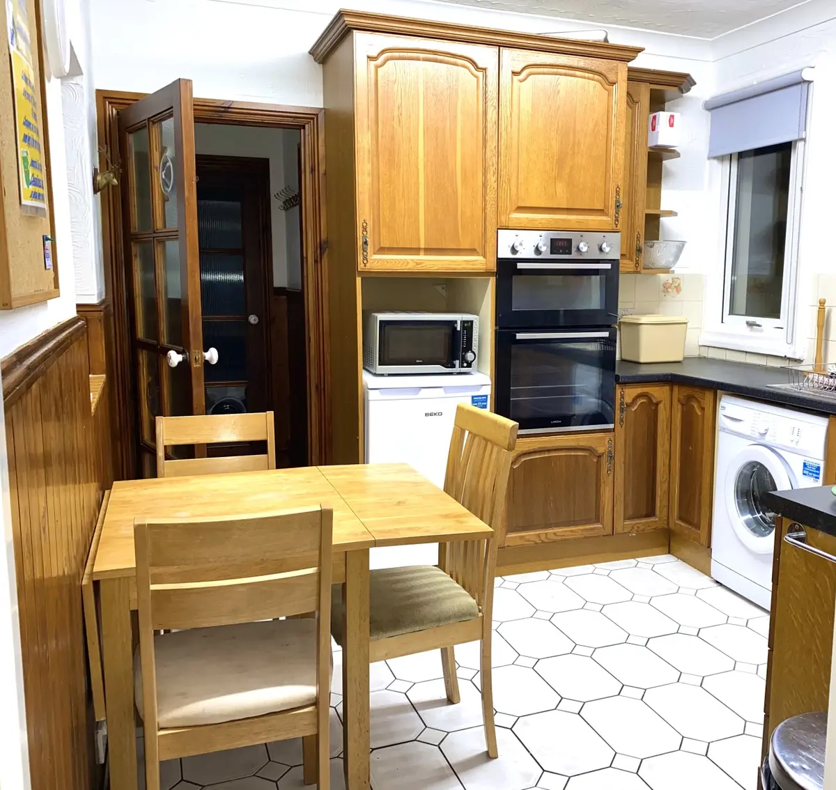 Kitchen and dining table in the Family Apartment